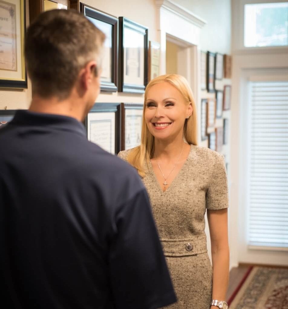 Fran Haasch meeting a client in the hallway