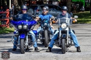 cotee river fire iron poker run men riding motorcycles