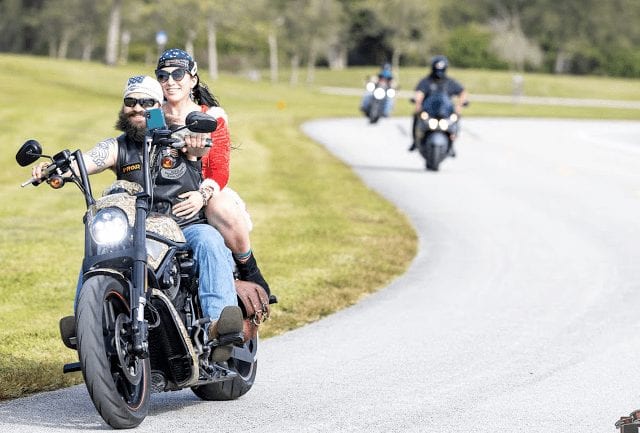 toy run with 3 motorcycles in the background riding curves