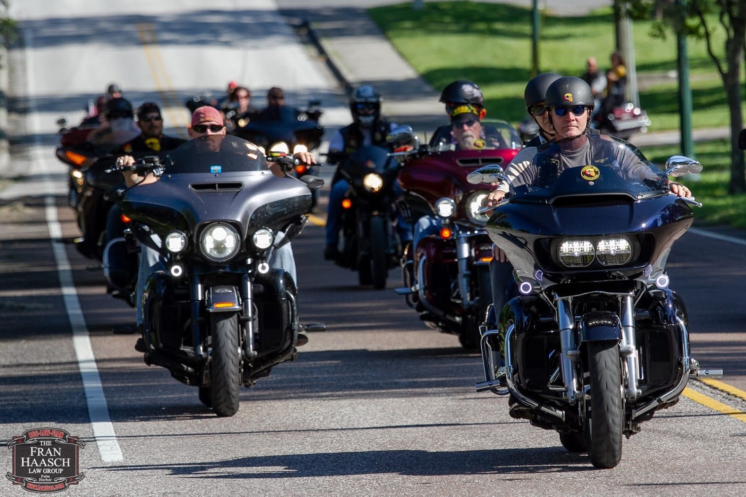 wreaths poker run wall of riders on motorcycles riding down the street