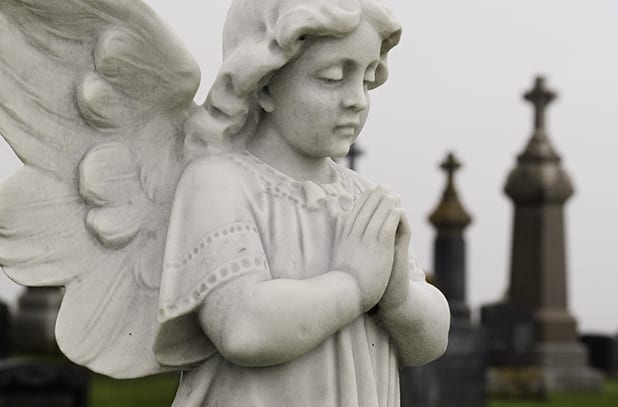 wrongful death angel praying statue