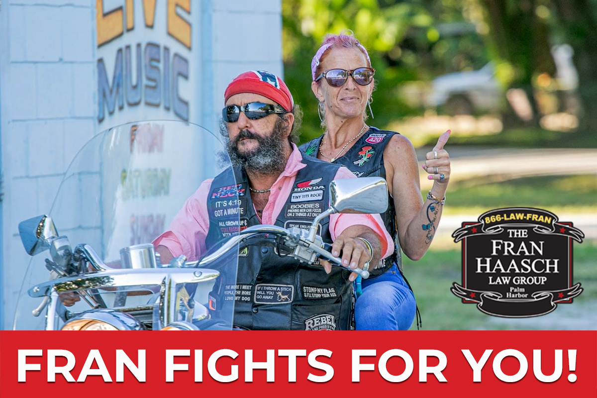 fran fights for you with couple riding a bike in background