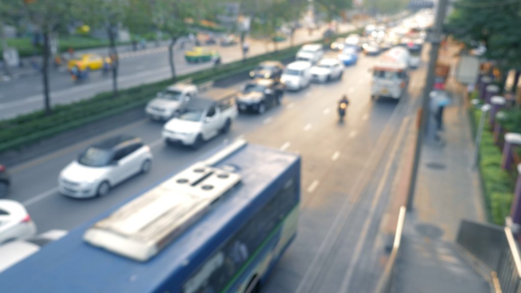 overhead view of 5 lane highway with traffic, blurred