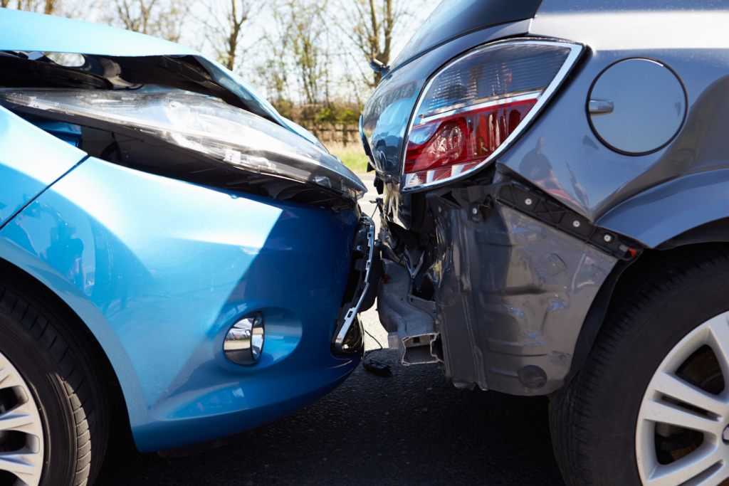 blue car rear ending a dark gray car in need of PIP insurance coverage in Florida