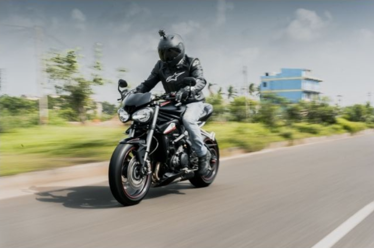 blur affect on an image with someone riding a motorcycle