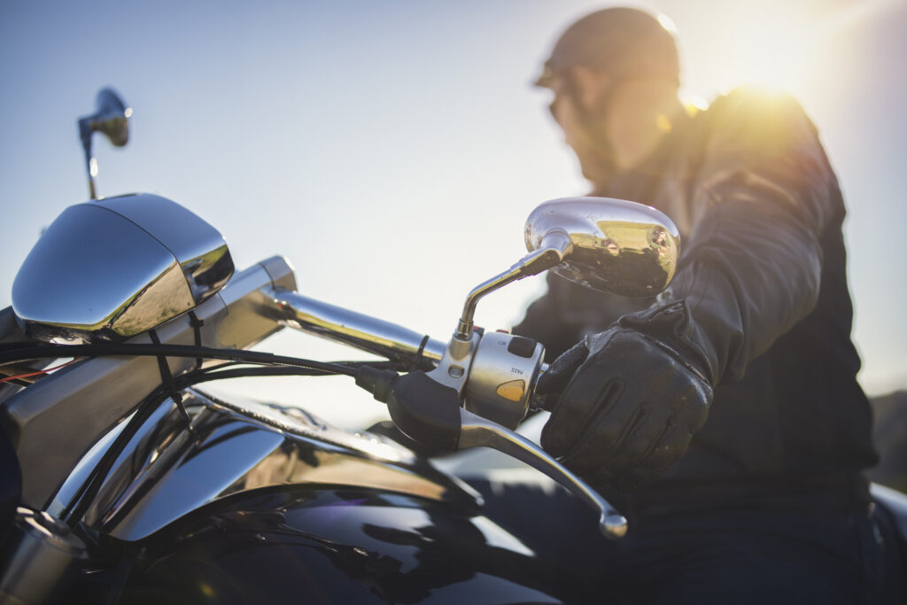 Close up shot of motorcyclist at sunset in florida without a motorcycle license