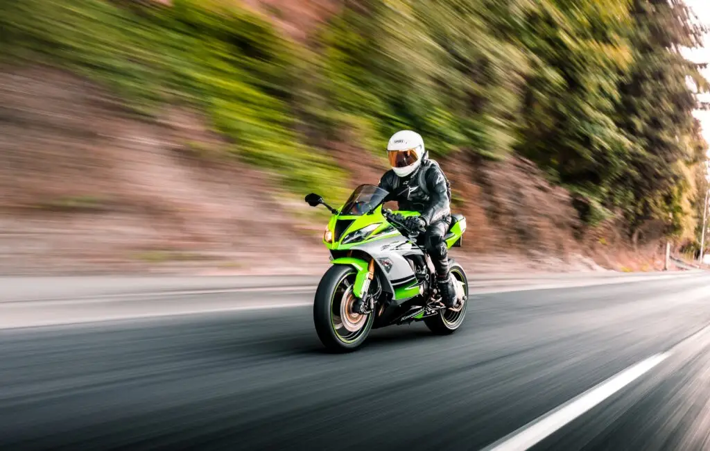 green electric motorcycle on a road in florida driving