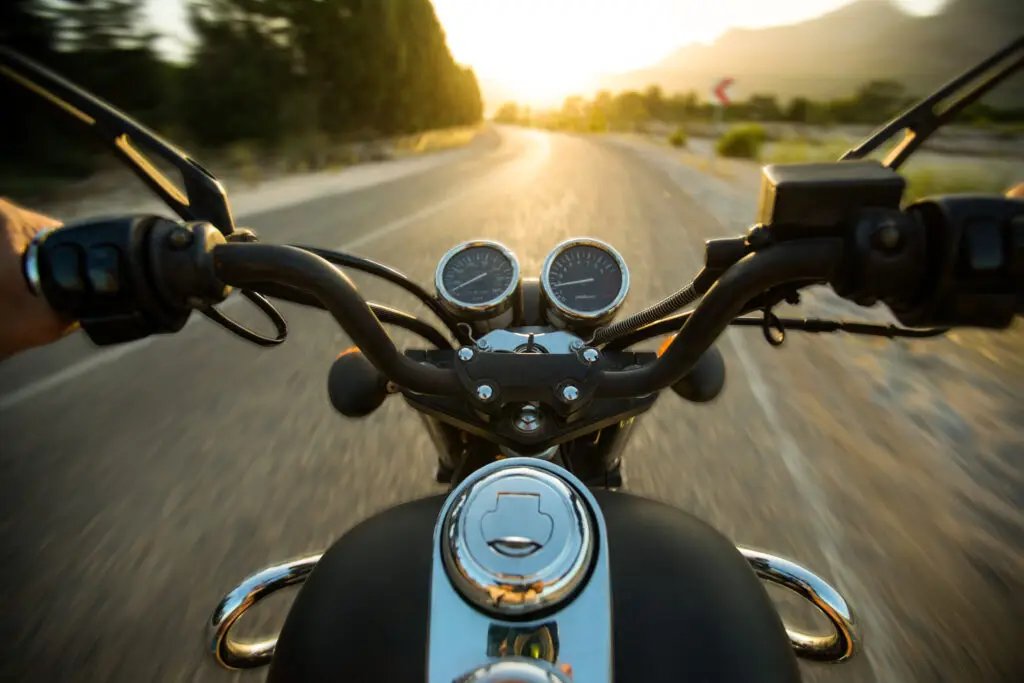 Traveling on a motorcycle on the roads, point of view from the drivers seat