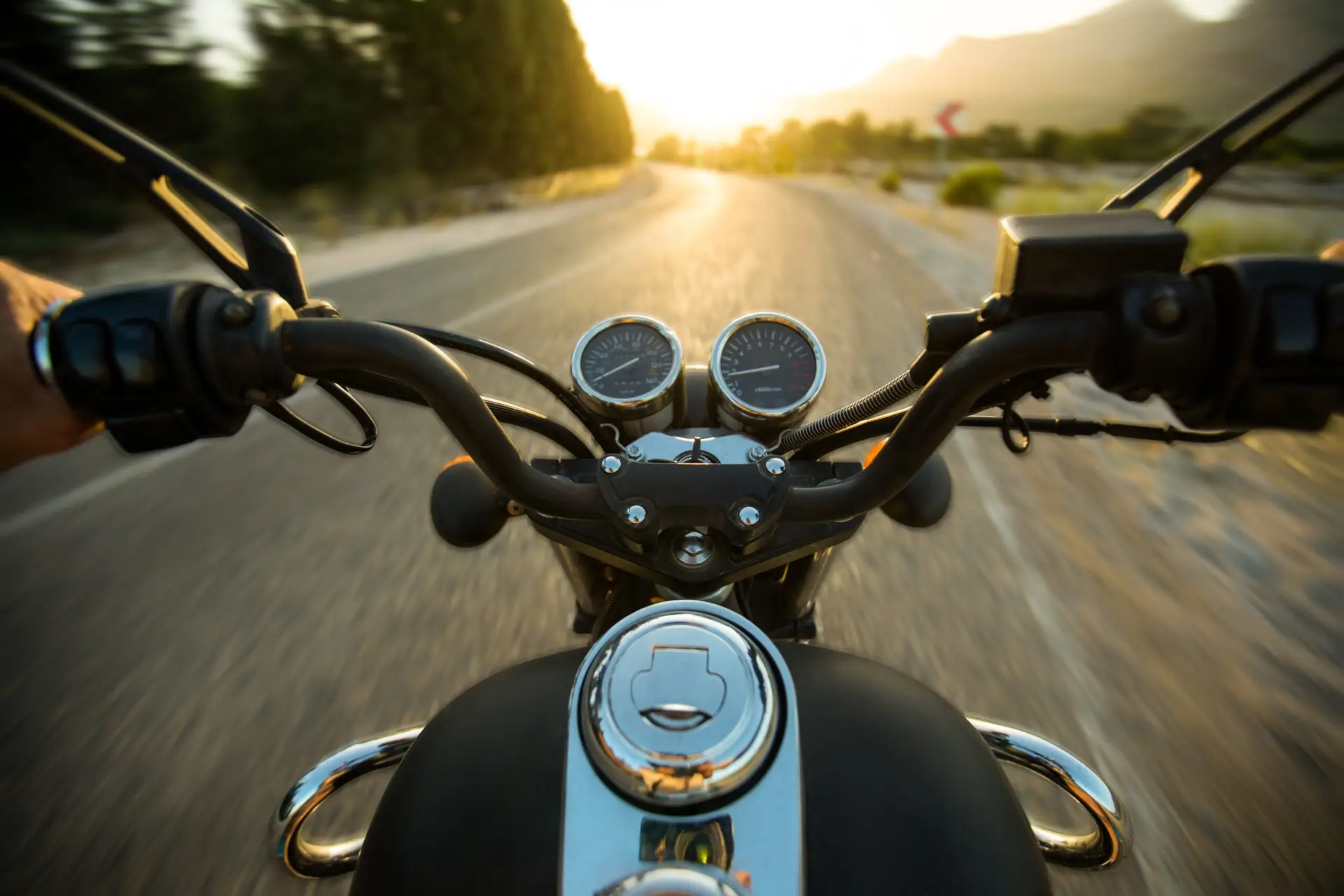 Traveling on a motorcycle on the roads, point of view from the drivers seat