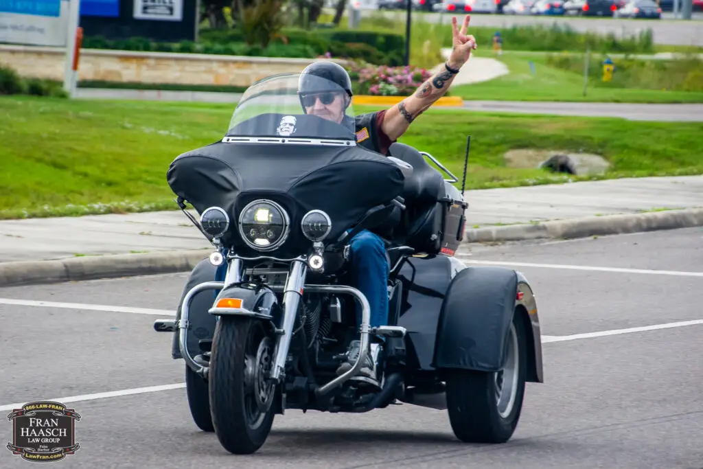 man riding a three wheeled motorcycle in florida
