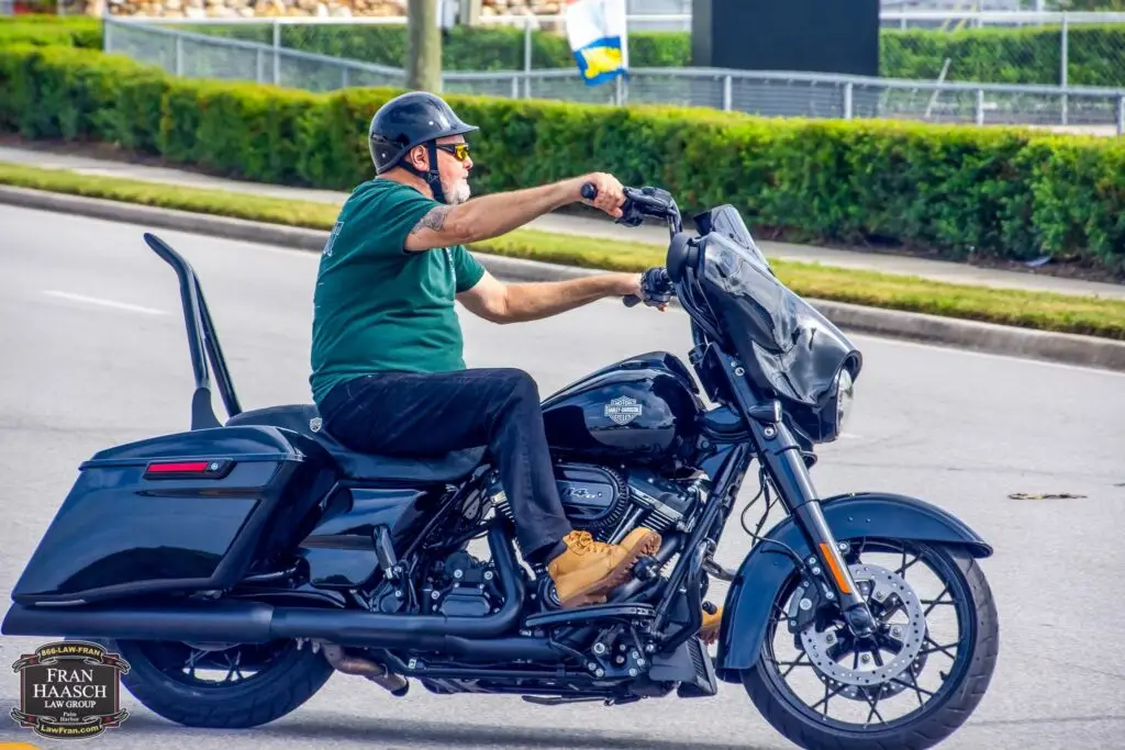 side profile view of a man riding a harley davidson in florida with a florida motorcycle license