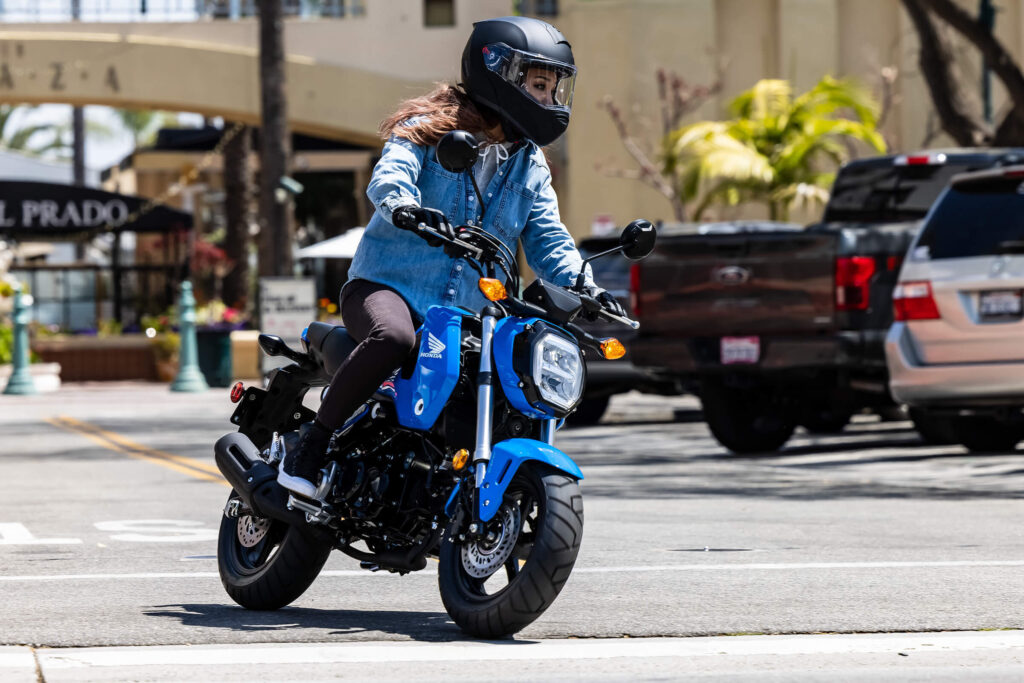 woman riding a grom with a motorcycle license in florida