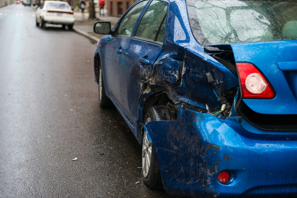 distracted driving Hit and run involving a parked car on a city street.