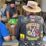 truckload of hurricane relief supplies and people loading it up , close up