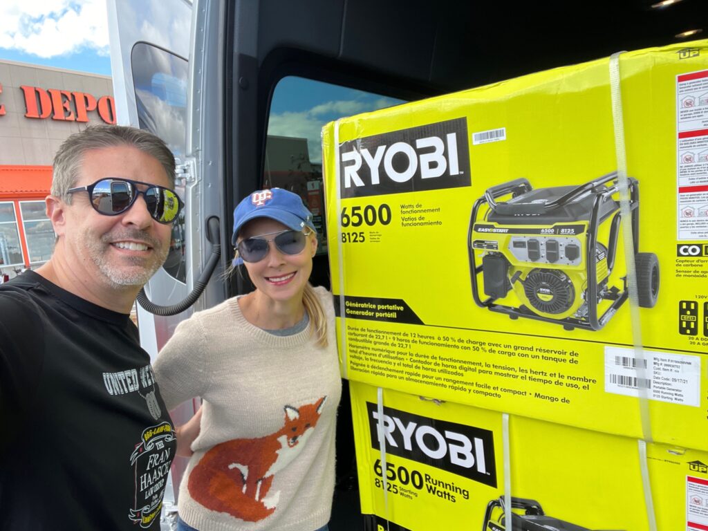 Fran, Rhett with generators in the back of a van