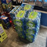 cases full of water sstacked 4 high