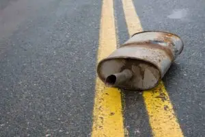 muffler in the middle of the road, road debris can cause damage