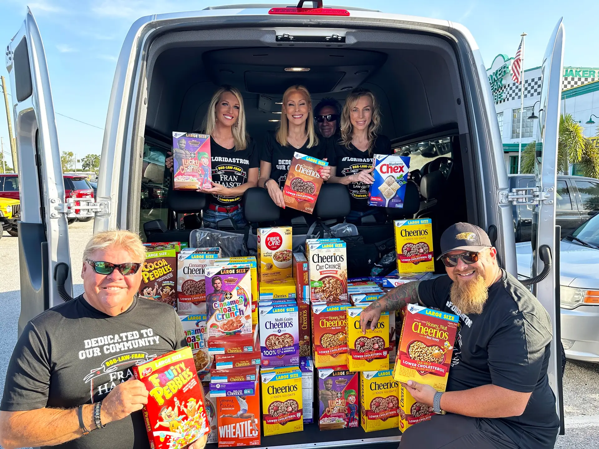 lawfran team with a van full of cereal - give back event