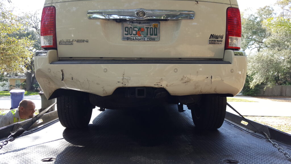 florida car on a tow truck after a car accident, rear end view of the car on a tow truck