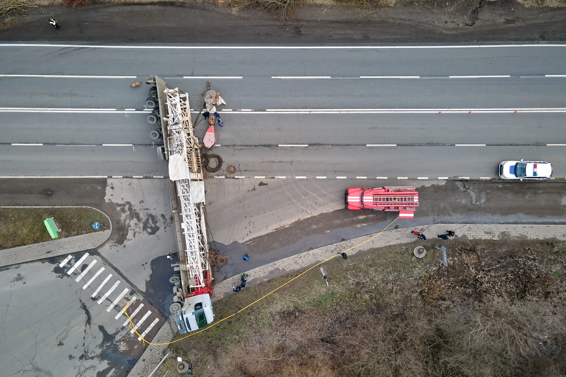 truck intersection accident with an aerial view of a truck on its side