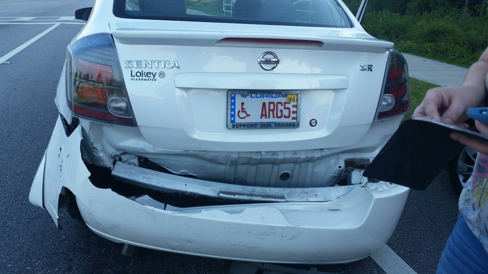 clearwater rear end accident, white car on the side of the road with rear damage