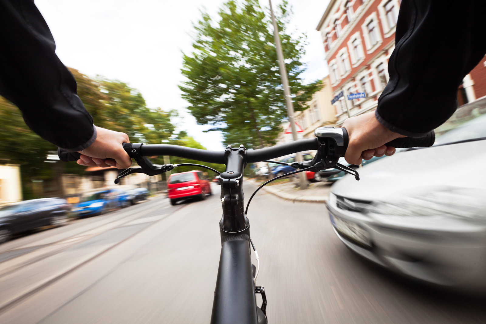 st petersburg bicycle scene, view from below the handlebars, man riding through the street