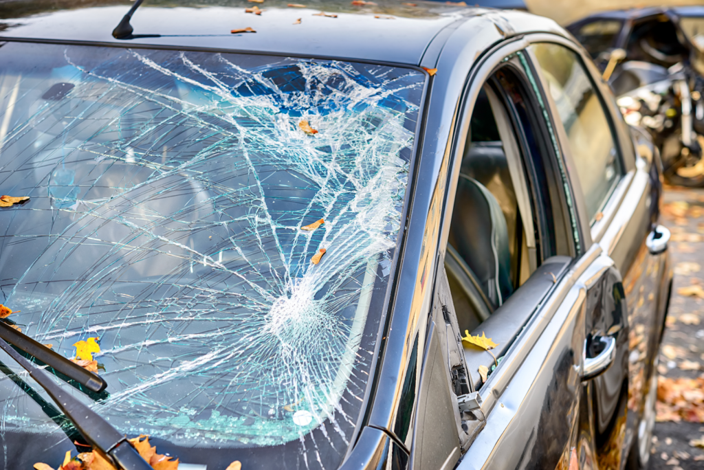 What Happens When Medicine Causes a Car Accident? front view of a damaged car windshield from an accident
