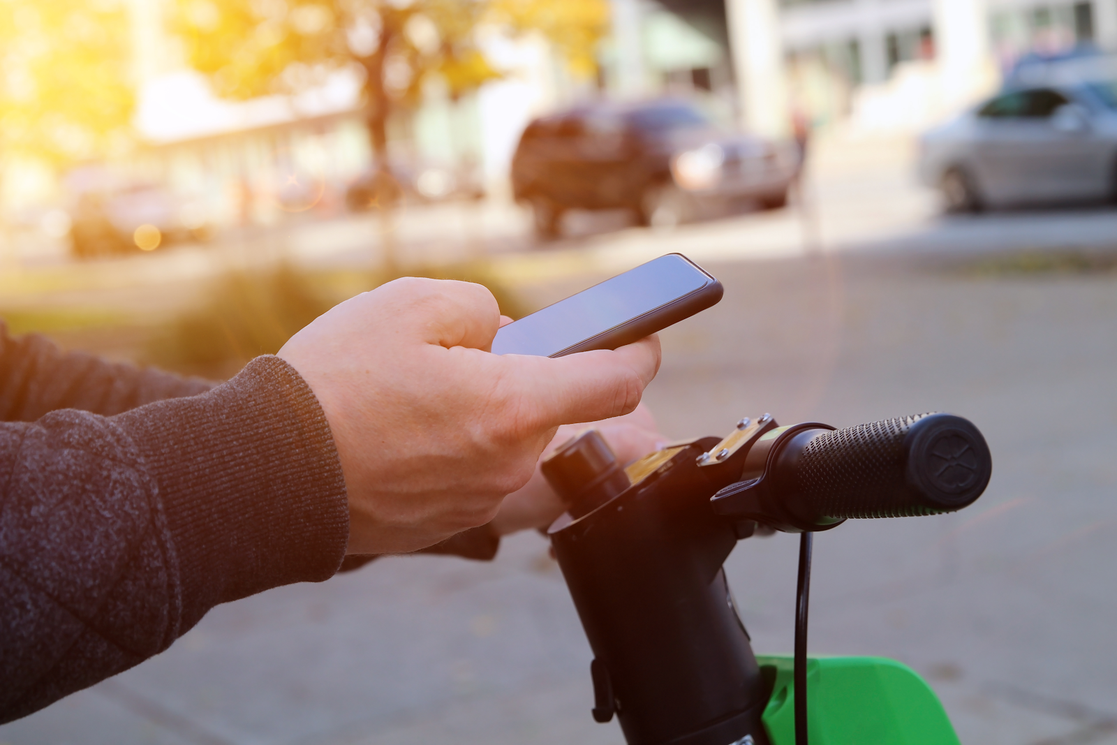 person using their phone to unlock an e scooter, electric scooter accident case theme