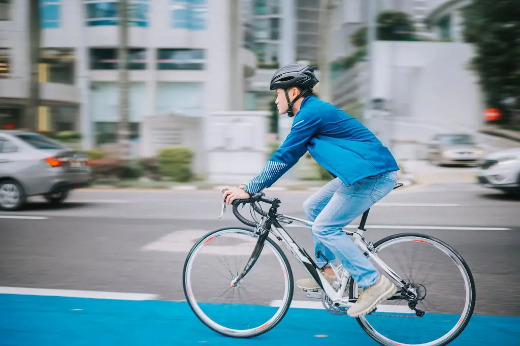a cyclist follows proper rules for safely operating a bicycle