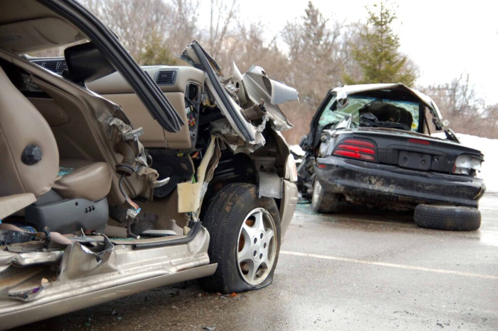 Two cars that were involved in a serious accident with extensive damage to both vehicles.